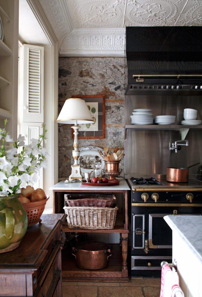 a kitchen with an oven, sink, and other items on the counter in front of it