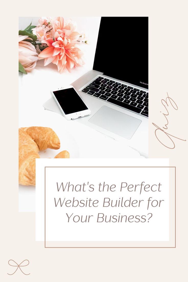 a laptop computer sitting on top of a desk next to a cup of coffee and croissants