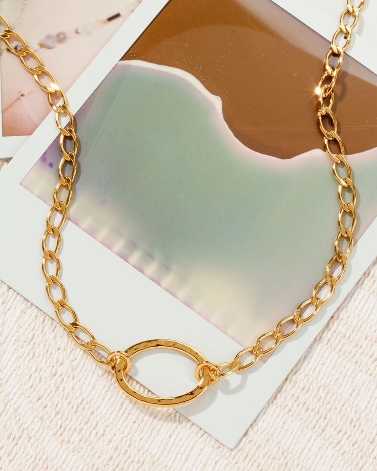 Boasting a beautiful golden plating that is perfectly crafted to accentuate all skin tones, this piece is sure to flatter every look. Not only is this piece beyond stunning, but it's also extremely versatile and can easily transition from day to night. Wear it as a single layer or layer it up - it's completely up to you! Chic Oval Link Metal Necklace, Chic Gold-tone Chain Necklace With Clavicle Chain, Chic Metal Oval Link Necklace, Trendy Gold Necklace With Adjustable Chain, Elegant Gold-tone Delicate Chain Choker, Chic Gold Chain Necklace Tarnish Resistant, Gold Link Metal Choker, Gold Jewelry With Clavicle Chain And Oval Link, Gold Jewelry With Oval Link Clavicle Chain