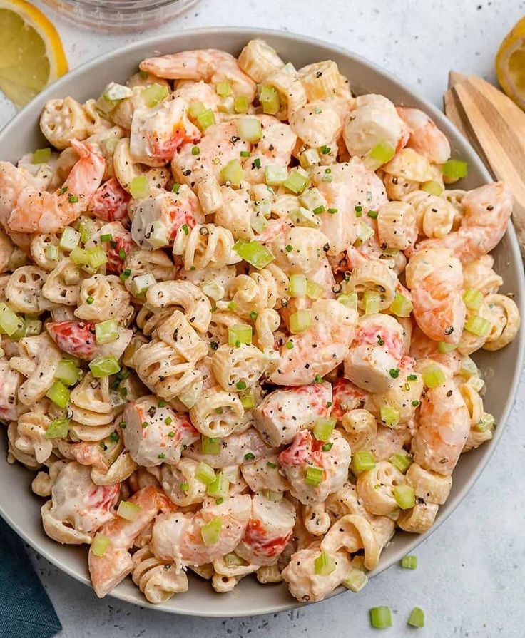 creamy shrimp pasta salad in a white bowl