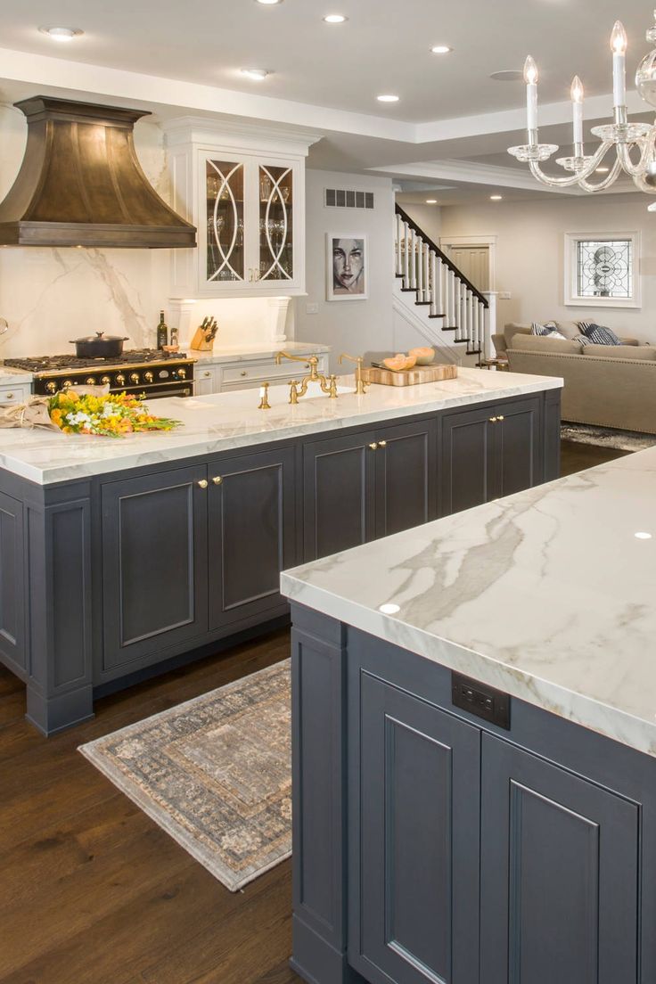 a large kitchen with an island and chandelier