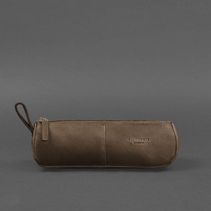 A leather pencil case-cosmetic bag is a versatile accessory that can be used to store any small items. Such an accessory will be good as a pencil case, glasses case, organizer for hygiene items, and other small things. The cosmetic bag is made of high-quality natural leather. This leather is incredibly soft and durable. The inner surface has a velvety, well-finished texture, so there is no need to make a lining. The pencil case-cosmetic bag is closed with a metal zipper. There is a leather loop Everyday Leather Pouch In Rectangular Shape, Minimalist Leather Pouch, Everyday Pencil Pouch With Pen Slots, Modern Rectangular Pencil Case For Everyday Use, Modern Everyday Pencil Case, Classic Pencil Case For Daily Use, Modern Leather Pencil Case For Travel, Modern Leather Pouch For Gift, Modern Leather Pouch As Gift