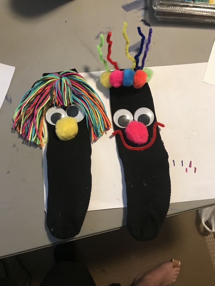 two puppets made to look like people's feet with hair and makeup on them