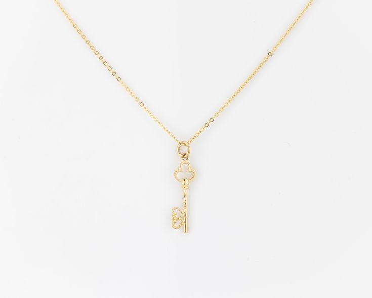 "\"KAYANA\" real vintage, 14k solid gold, dainty minimalist skeleton key pendant (on a complimentary gold plated sterling silver chain). The pendant features two interwoven hearts at the end of the key. We have two of these in stock that are identical, they go well together as a matching set- grab em while they're still available! (Just add two to cart- if only one is available then the other one has sold.) More necklaces: https://dvnejewelryco.etsy.com SIMILARLY: dainty gold plated sterling sil Elegant Sterling Silver Key Jewelry, Classic Jewelry With Keys For Gifts, Elegant Sterling Silver Key Necklace, Elegant Two Keys Necklace As Gift, Elegant Two Keys Necklace Gift, Elegant Two Keys Necklace For Gift, Elegant Key Pendant Necklace, Gold Key Pendant Jewelry, Yellow Gold Key Pendant Jewelry