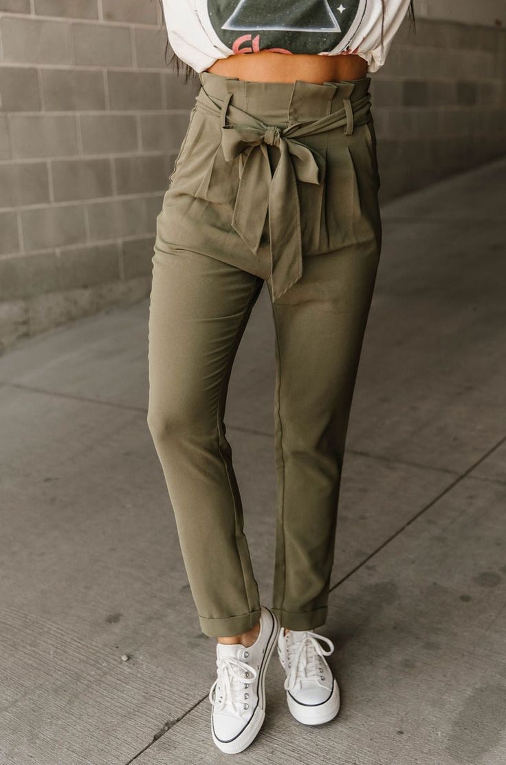 Make a style statement with these olive Nicola Pants! With their high-waisted paperbag detail and self-tie belt, you can show off your fashion sense while maintaining a comfortable fit. The pleated details, side pockets, cuffed hem, and tapered leg fit will have you feeling stylish no matter where you go. Talk about a pants party! 🎉 High-waisted with paperbag detail Self tie belt Pleated details Side pockets Tapered leg fit Cuffed ankle-length hem Fit and sizing: See Lily's sizing HERE, she is Green Paperbag Pants Outfit, Paperbag Pants Outfit, Paperbag Pants, Style Statement, Tie Belt, Pants Outfit, Fashion Sense, Tapered Legs, Fashion Pants