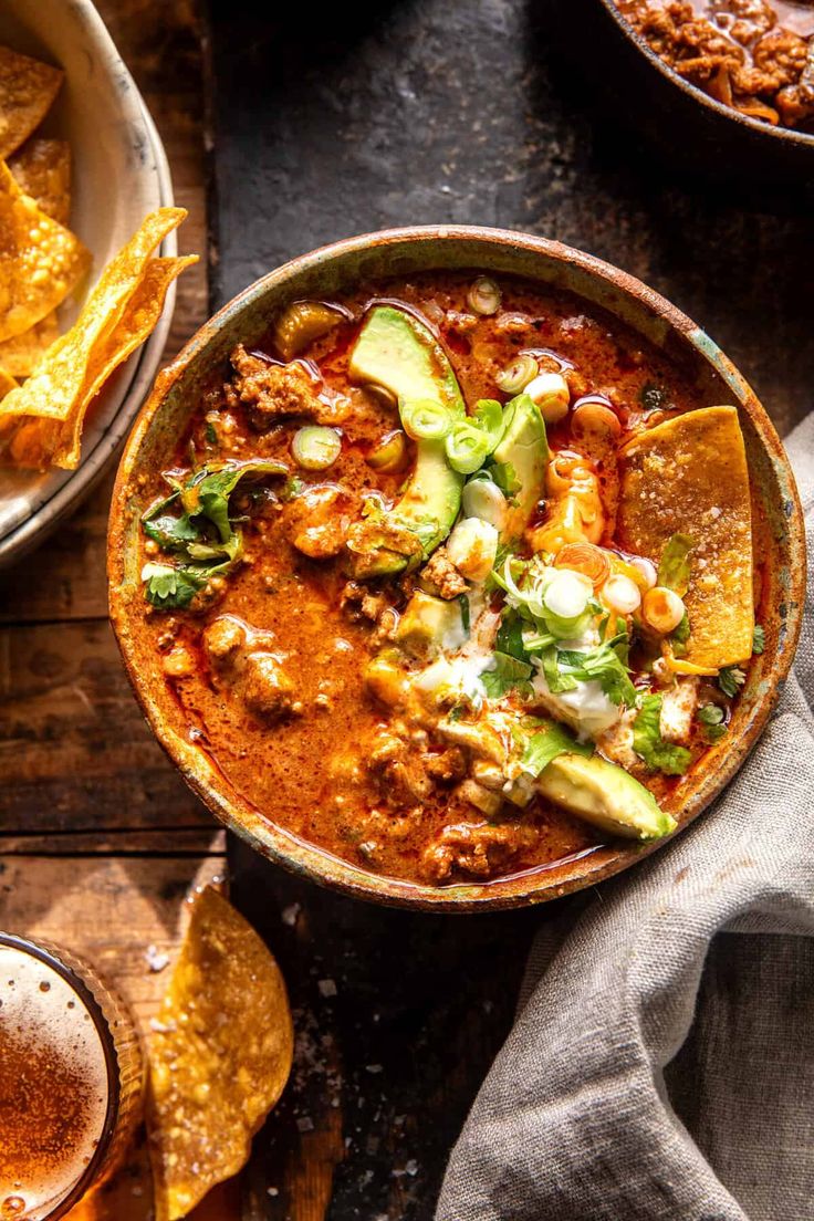 a bowl filled with chili and tortilla chips