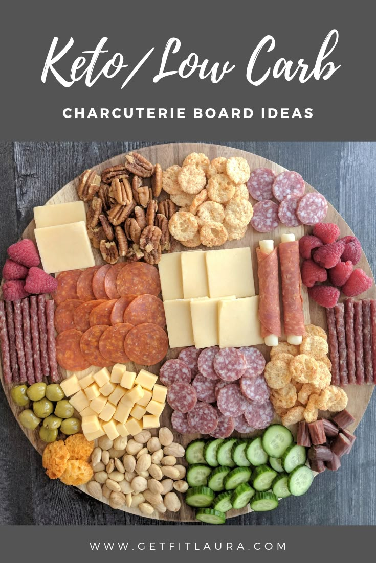 a platter filled with different types of cheese and crackers on top of it