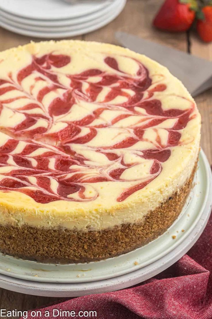 a cheesecake topped with strawberries on a plate