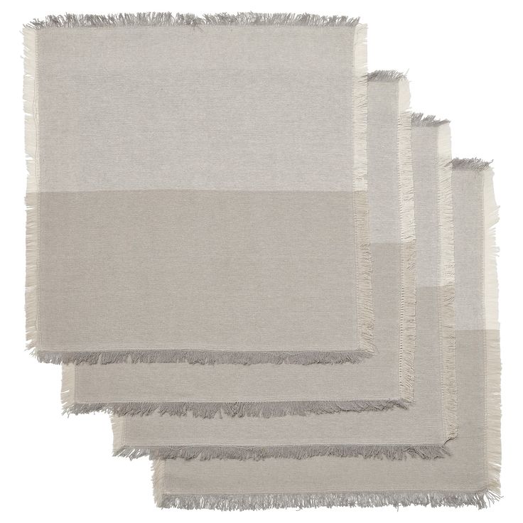 four pieces of white and grey fabric with fringes