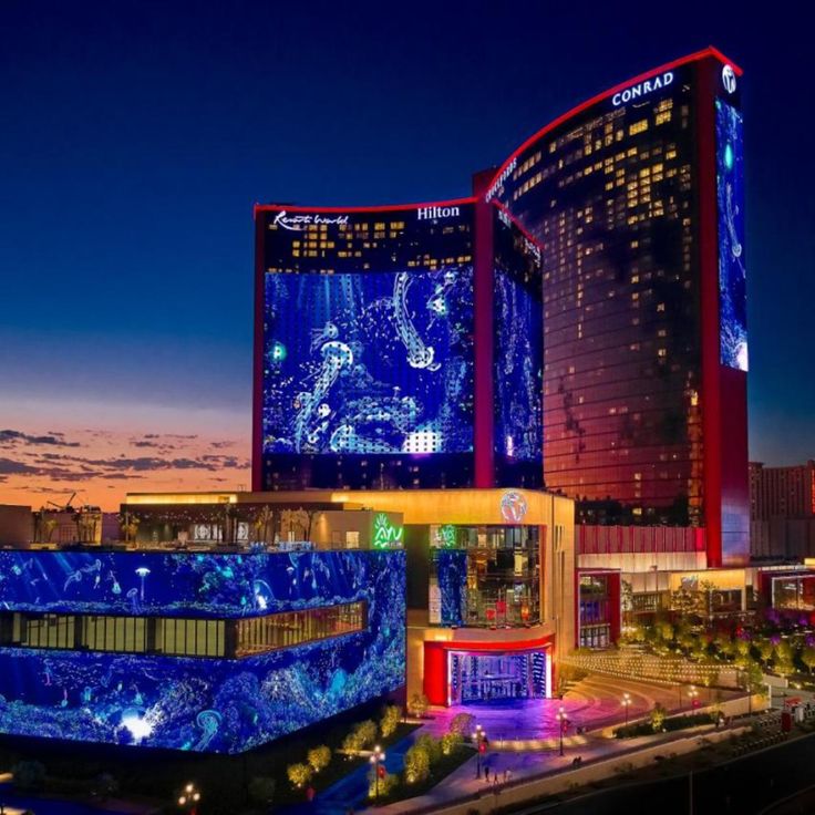 the las vegas hotel and casino is lit up in blue for the new year's eve celebration