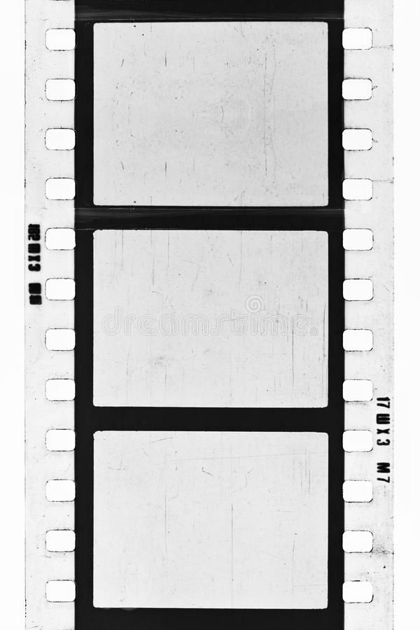 an old film strip that is black and white with some small squares on the side