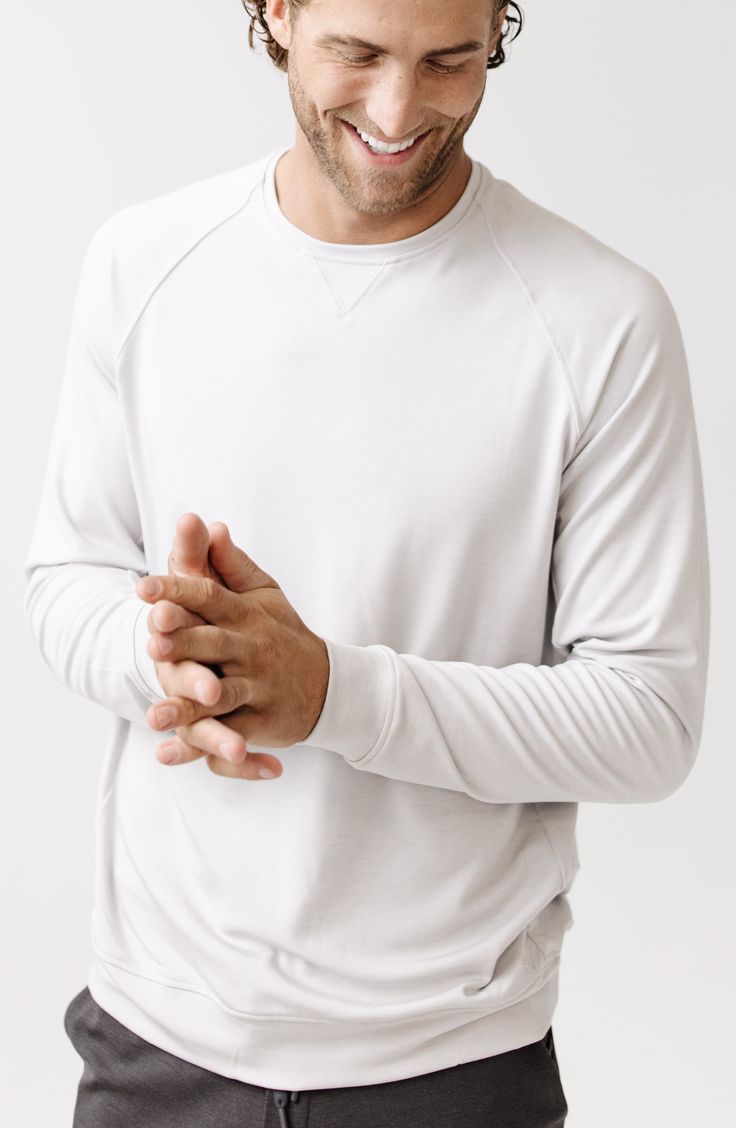 Soft, breathable and all-day comfortable, this stretchy crewneck sweatshirt wicks away moisture and makes a great go-to whether you're active or relaxing. Crewneck Moisture-wicking fabric engineered for dryness and comfort 70% viscose, 26% acrylic, 4% spandex Machine wash, tumble dry Imported White Stretch Crew Neck Sweatshirt, White Moisture-wicking Sweatshirt For Fall, Sporty Sweatshirt With Raglan Sleeves For Everyday, Sporty Everyday Sweatshirt With Raglan Sleeves, French Terry Crew Neck Top, Solid French Terry Crew Neck Top, Solid French Terry Tops With Crew Neck, Solid Color French Terry Tops With Crew Neck, Solid Crew Neck Tops In French Terry