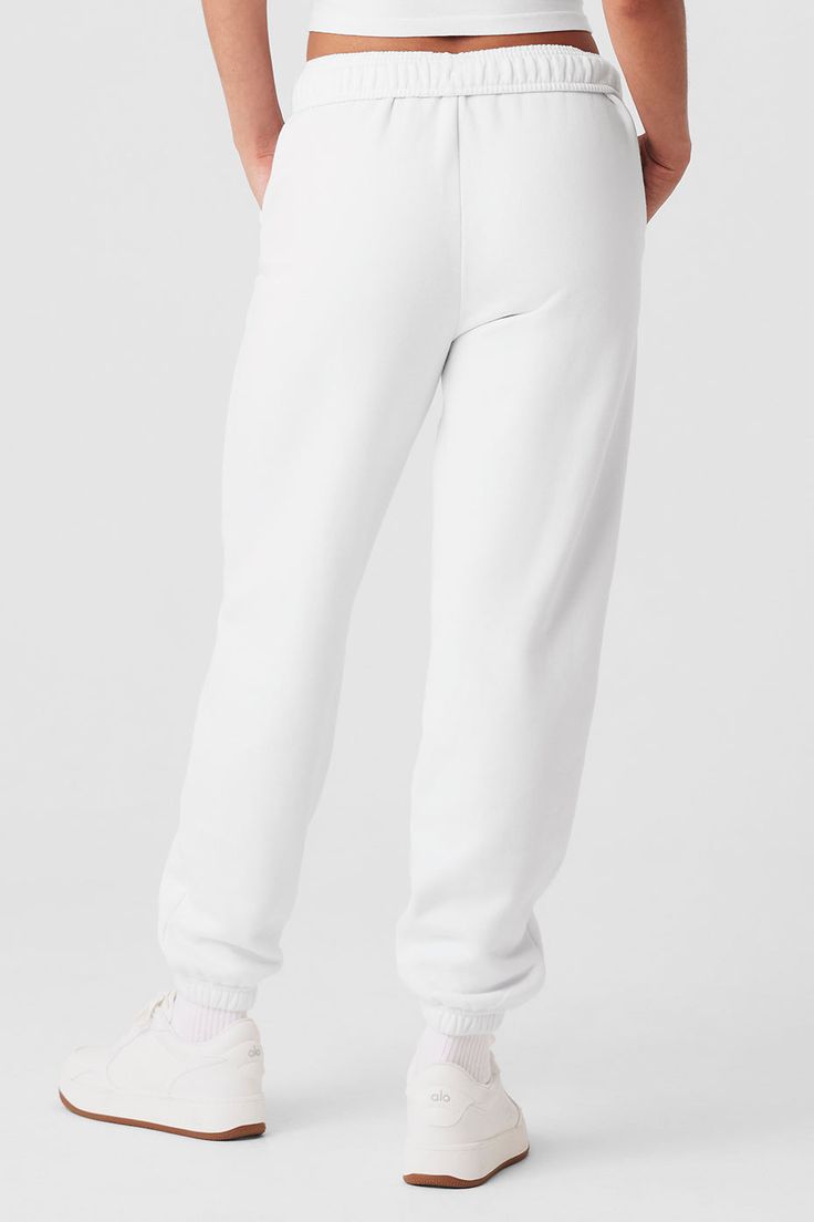 The search for the perfect lounge-to-street look is over. Our iconic sweats have classic details, like an elastic waistband and cuffs, plus a relaxed fit that reads laid-back but not slouchy (since this is a unisex style, we recommend sizing down to achieve this look). The French terry feels smooth on the outside and fleecy on the inside. And may we suggest a matching Accolade Hoodie or Crew Neck? Find your fit and see all the ways to style it. EXPLORE ACCOLADE. Trendy Cotton Joggers For Lounging, Comfy Sweatpants With Elastic Waistband For Spring, Trendy Sweatpants For Lounging, Sporty Cotton Bottoms By Alo Yoga, Basic Loungewear Pants With Elastic Cuffs, Alo Yoga Bottoms With Ribbed Waistband, Sporty Relaxed Fit Sweatpants With Ribbed Cuffs, Trendy Relaxed Fit Sweatpants With Elastic Cuffs, Sporty Sweatpants With Ribbed Cuffs And Relaxed Fit