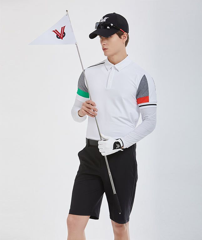 a young man holding a golf club and a white flag in his left hand while wearing black shorts