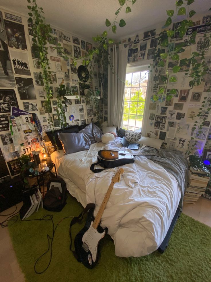 a bed room with a guitar laying on top of it