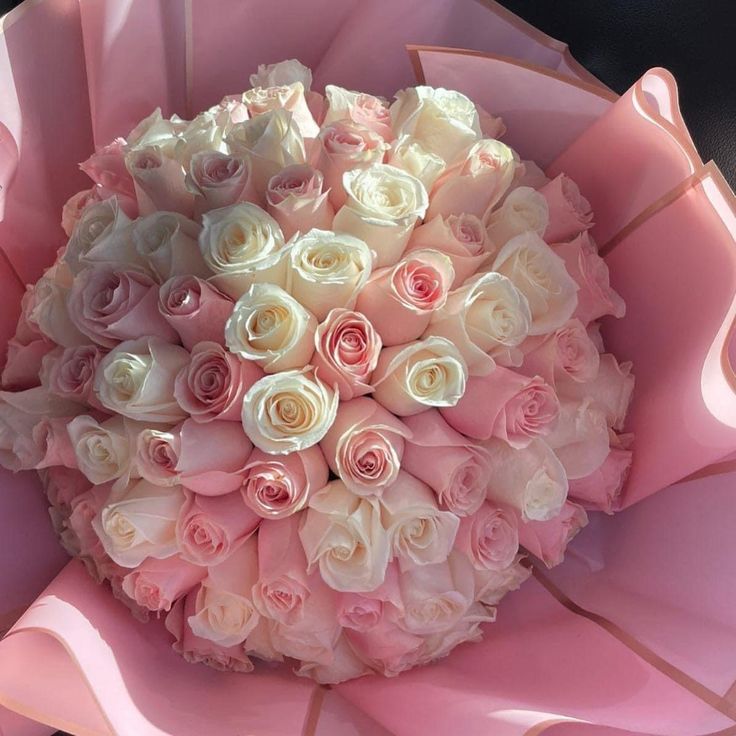 a large bouquet of pink and white roses