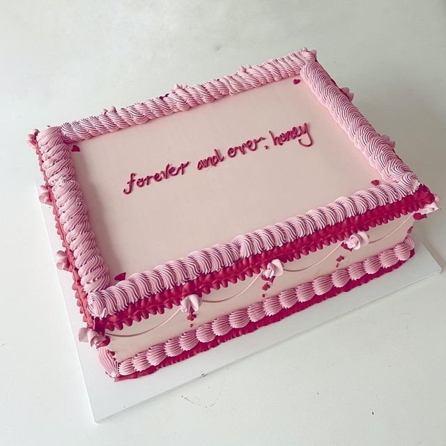 a cake with pink icing on it that says forever and ever - today in red lettering