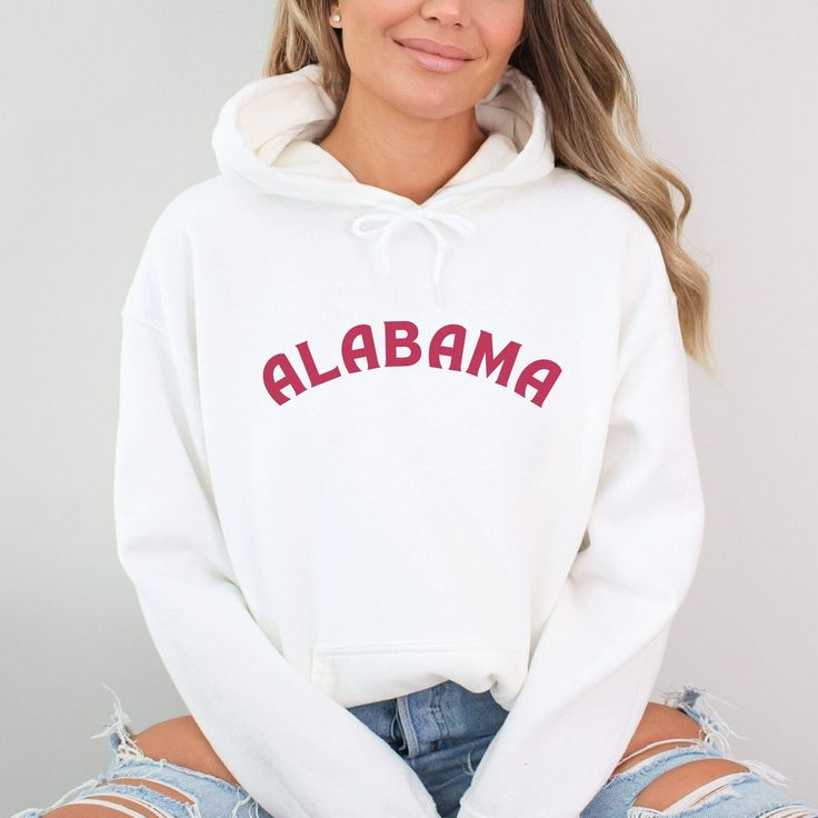 Stay warm and show your Crimson Tide pride with our cozy Alabama hoodie, perfect for game day and tailgating. This Alabama football sweatshirt makes an ideal gift for Bama moms and students, offering stylish university apparel for any occasion. Prefer this design on a T-Shirt? Visit this link: https://bohemianbloomdesigns.etsy.com/listing/1760990041 Prefer this design on a Sweatshirt? Visit this link: https://bohemianbloomdesigns.etsy.com/listing/1760993473 Everything You Need to Know: 🧥 Sweats Game Day Long Sleeve Fan Apparel Hoodie, Game Day Fan Apparel Hoodie With Long Sleeves, Collegiate Hooded Tops For Game Day, Game Day Fan Apparel Tops With Drawstring Hood, Collegiate Hoodie Tops For College, Collegiate Style Hoodie For College, College Team Spirit Hoodie Top, Team Spirit Hoodie For College, Casual Hoodie With Team Name