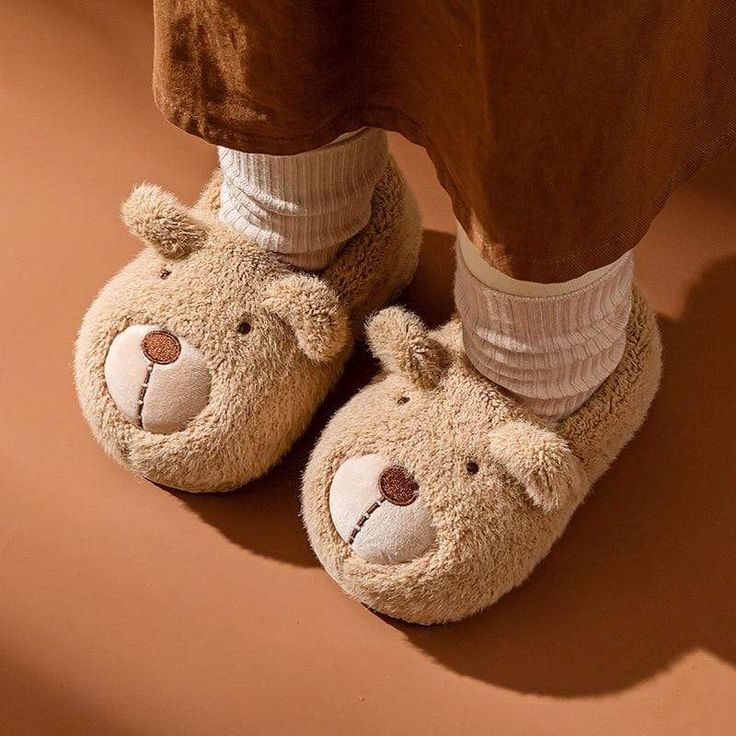 Nothing beats slipping your feet into a warm pair of slippers on a chilly winter morning. With cute cartoon bear design slippers, your girls are sure to find their new favorite creature comforts. It is crafted from soft fabric and flexible insoles; these adorable bear kid slippers prioritise comfort before all else. So get ready for bedtime with the help of some fluffy characters when you slip into these bear slippers. Upper Material: Fur Lining Material: Suede Kids Bunny Slippers, Fluffy Bunny Slippers, Kid Slippers, Elephant Slippers, Trendy Slippers, Shark Slippers, Cute Cartoon Bear, Bear Slippers, Bunny Slippers