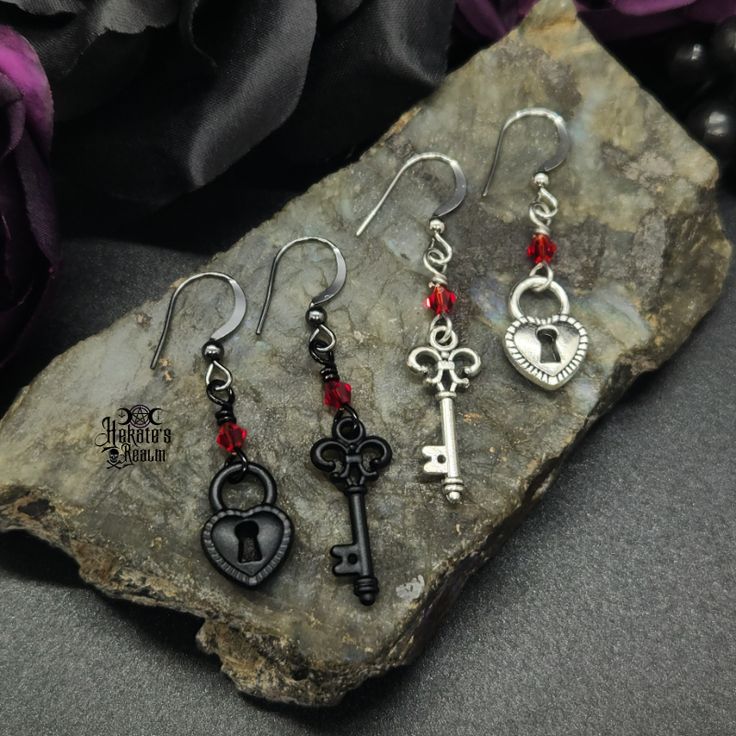 Embrace this Valloween with these enticing Locked Up Heart Earrings. These asymmetrical beauties are sure to enhance those victorian, vampy, goth vibes in your look. Enhance your gothic vampire look and pair with our matching choker/necklace. Happy Valloween!Locked Up Heart Earrings Details: Fashion Jewelry ~ Handmade Asymmetrical Ruby Crystal Accents Key Length: 53mm Heart Lock Length: 46mm Key Earrings Aesthetic, Victorian Goth Jewelry, Vampire Jewelry, Vampire Look, Goth Vibes, Key Earrings, Weird Jewelry, Goth Earrings, Victorian Aesthetic