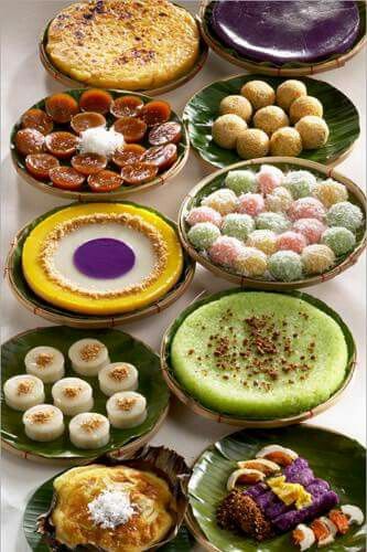 a table topped with plates filled with different types of desserts on top of each other