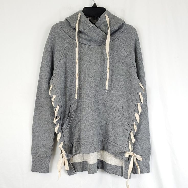 New With Tags - Please Look At Photos Closely Lace Down From Under Arm To Lower Hem Distress Hole On Hoodie And Edges Front Pocket Longer Hem In The Back Approx Measurements Armpit To Cuff 18.5in Bust 20in. Length Front 22in. Back 26in. Gray Drawstring Top For Fall, Gray Drawstring Hoodie Top, Gray Winter Sweatshirt With Drawstring, Casual Gray Sweatshirt With Drawstring, Gray Drawstring Sweatshirt For Winter, Gray Drawstring Hoodie, Comfy Gray Sweatshirt With Drawstring Hood, Gray Long Sleeve Sweatshirt With Drawstring, Gray Sporty Sweatshirt With Drawstring