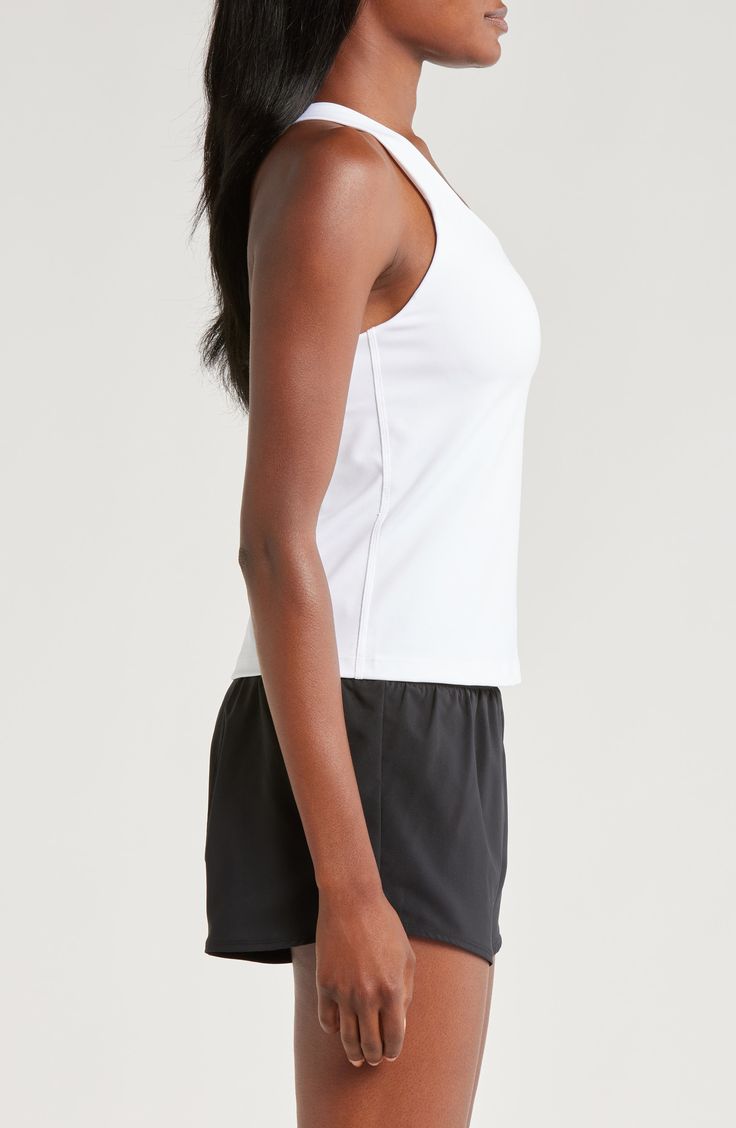 A built-in shelf-bra keeps you supported in this racerback tank top cut with signature Dri-FIT technology for cool, dry comfort as you work up a sweat. 20 1/2" length (size medium) Scoop neck Racerback Built-in shelf-bra Dri-FIT moisture-wicking technology 82% polyester, 18% spandex Machine wash, line dry Imported Sleeveless Micro-elastic Activewear With Built-in Bra, Moisture-wicking 4-way Stretch Tank Sports Bra, Micro-elastic Sleeveless Sports Bra For Yoga, Micro-elastic Sleeveless Activewear With Built-in Bra, Nike Medium Support Moisture-wicking Sports Bra, Shelf Bra, Nike Dri Fit, White Stone, Racerback Tank Top