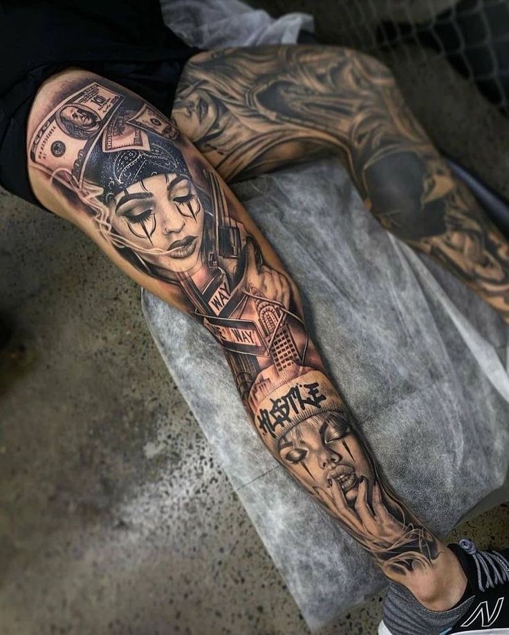 a man's leg with tattoos on it and his arm is covered in money