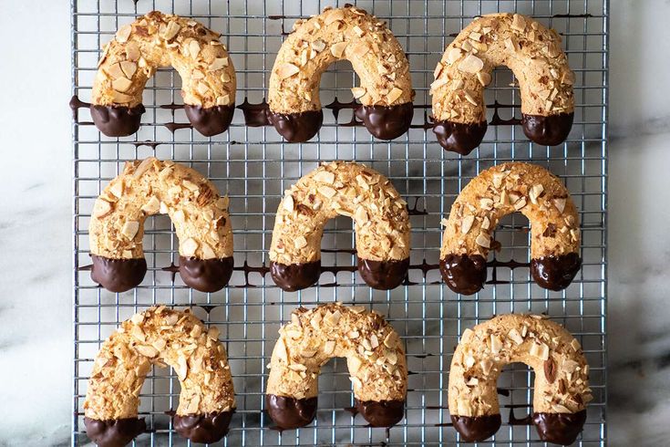 chocolate covered donuts on a cooling rack ready to go into the oven for baking