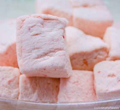 some pink marshmallows are in a bowl