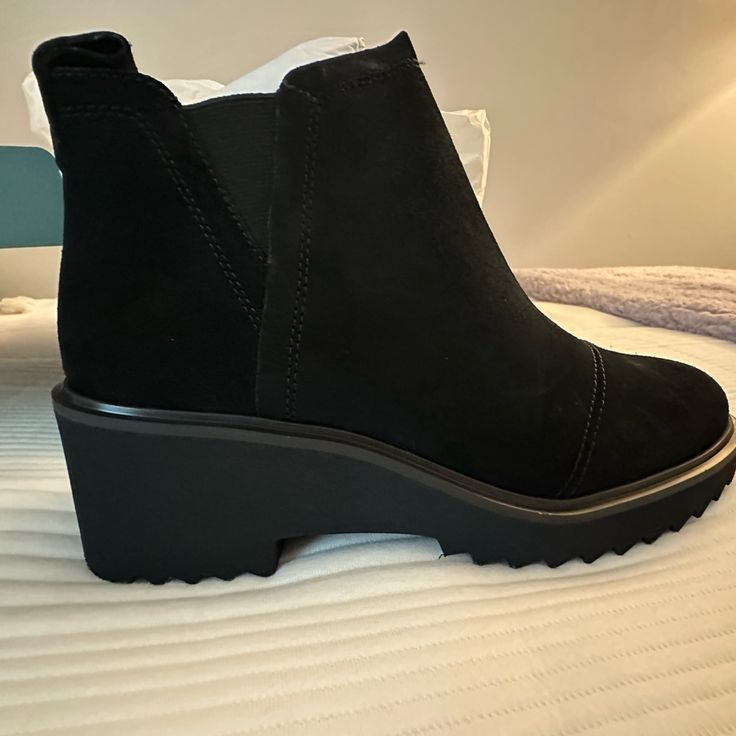 Brand New Never Worn Black Synthetic Boots With Cushioned Footbed, Black Slip-on Boots With Removable Insole, Comfortable Black Slip-on Boots, Black Slip-on Boots With Textured Sole, Black Slip-on Spring Boots, Chic Black Boots With Removable Insole, Black Ankle-high Boots With Removable Insole, Black Slip-on Boots For Spring, Black Synthetic Boots With Leather Footbed