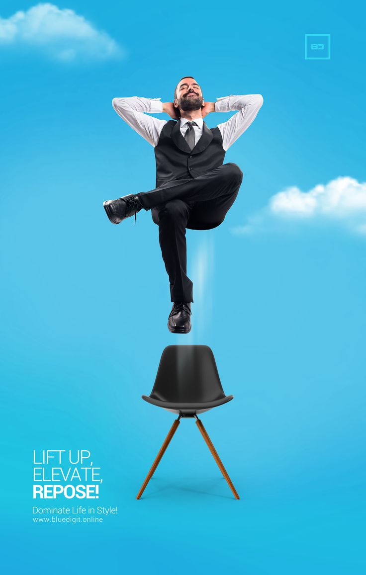 a man sitting on top of a chair in the air with his hands behind his head