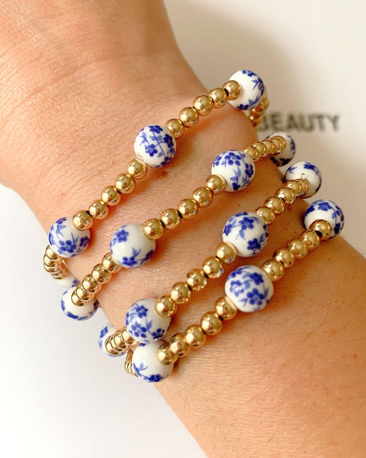 Blue Floral gold beaded bracelet Gold Stretch Bracelet With Colorful Beads, Adjustable Beaded Bracelet Jewelry, Adjustable Beaded Chain Bracelet Jewelry, Adjustable Beaded Chain Bracelet, Gold-tone Beaded Jewelry, Bohemian 14k Gold-filled Jewelry With Colorful Beads, Colorful Beads 14k Gold-filled Jewelry Gift, Blue Bangle Jewelry With Large Beads, Adjustable Gold Jewelry With Colorful Beads