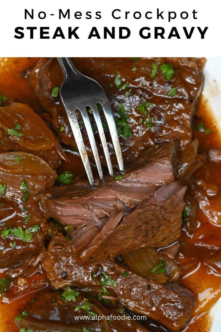 a white plate topped with steak and gravy