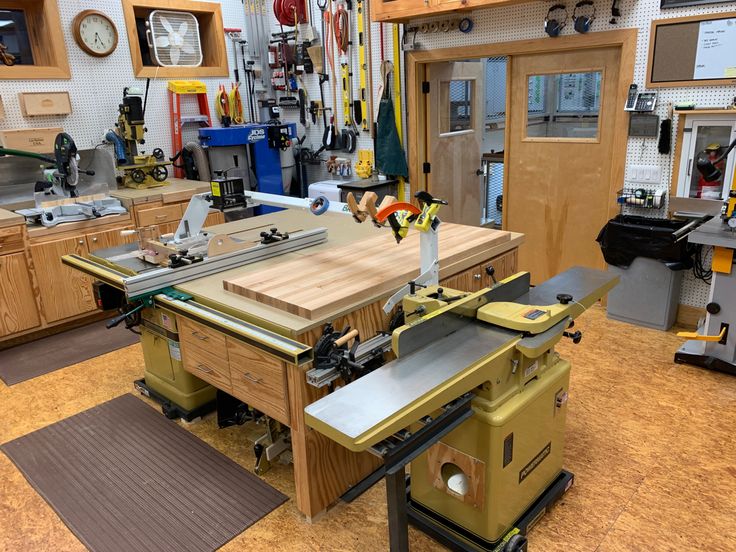 a workbench in a shop with tools on the table and other woodworking equipment