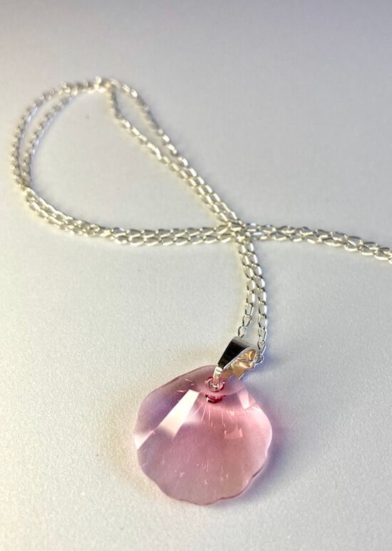 A gorgeous pinky seashell necklace will grace your neck day by day.

But beware, this is no ordinary shell, it's one beautiful piece of Swarovski®️ Crystal that is going to bring you a lot of happiness. 

It comes on a beautiful silver necklace in custom Orca Legacy packaging, with a leaflet detailing our mission and a sticker as a gift for you.

Necklace length: 45cm/17.7 or 50cm/19.5inch

Assembled by hand in the heart of Europe, with lots of love for the ocean!
Making a difference
Orca Legacy Elegant Pink Sterling Silver Crystal Necklace, Pink Briolette Necklace For Gift, Pink Round Pendant Jewelry With Lobster Clasp, Pink Teardrop Necklace For Gift, Pink Faceted Pendant Jewelry, Pink Sterling Silver Pendant Crystal Necklace, Pink Faceted Pendant, Pink Teardrop Sterling Silver Necklace, Pink Sterling Silver Round Necklace