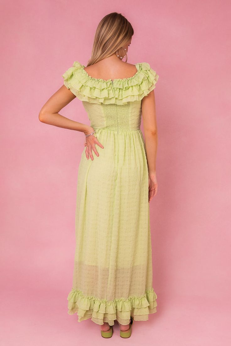 The Havana Dress is our favorite playful and cute option! The green textured print adds a summer touch to the maxi wrap skirt, while the tiered ruffle neckline and flutter sleeves bring a touch of whimsy. With a hidden back zipper and non-stretch fabric, this dress is as comfortable as it is stylish. Summer Flowy Maxi Dress With Ruffled Skirt, Flowy Summer Maxi Dress With Ruffled Skirt, Flowy Ruffled Skirt Maxi Dress For Summer, Green Midi Dress With Ruffles For Beach, Summer Maxi Dress With Ruffles And Short Sleeves, Green Tiered Midi Dress For Brunch, Green Tiered Skirt Midi Dress For Brunch, Vacation Maxi Dress With Ruffled Skirt And Straps, Maxi Dress With Ruffled Skirt And Straps For Vacation