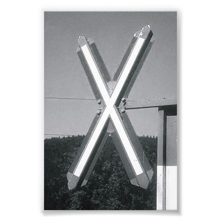 a black and white photo of two metal poles