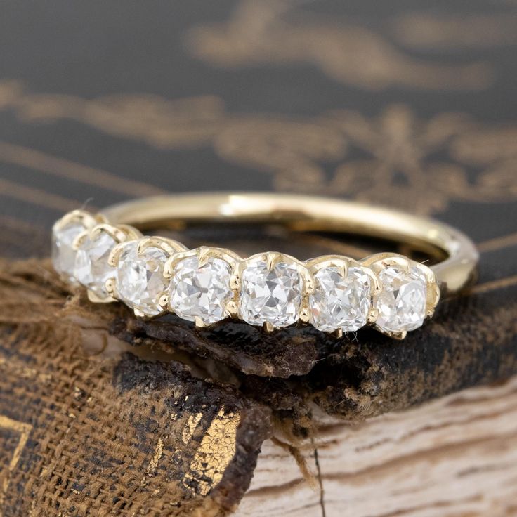 Modeled after antique diamond bands from the Georgian and Victorian eras, this band is set with chunky and charming old mine cut diamonds in 18kt Yellow Gold! The diamonds are bright and sparkly and just looks so beautiful and elegant on the finger. 18kt Yellow Gold Size 5, and fully sizable Measures: 2.53mm H & 18.83mm W Diamonds are natural and Earth-mined, approx. G/H colors, VS/SI clarities Timeless Cushion Cut Diamond Ring With Rose Cut Diamonds, Heirloom Baguette Cut Diamond Ring With Rose Cut Diamonds, Heirloom Cushion Cut Single Diamonds Wedding Ring, Heirloom Cushion-cut Single Diamond Wedding Ring, Heirloom Baguette Cut Rose Cut Diamond Ring, Heirloom Rose Cut Baguette Diamond Ring, Heirloom Asscher Cut Diamond Ring With Rose Cut Diamonds, Heirloom Asscher Cut Rose Diamond Ring, Wedding Diamond Ring With Rose Cut Cushion Shape