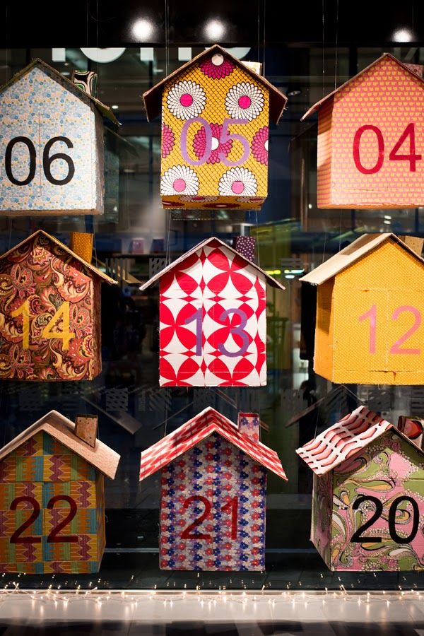 a display case filled with lots of different types of houses and numbers on each side