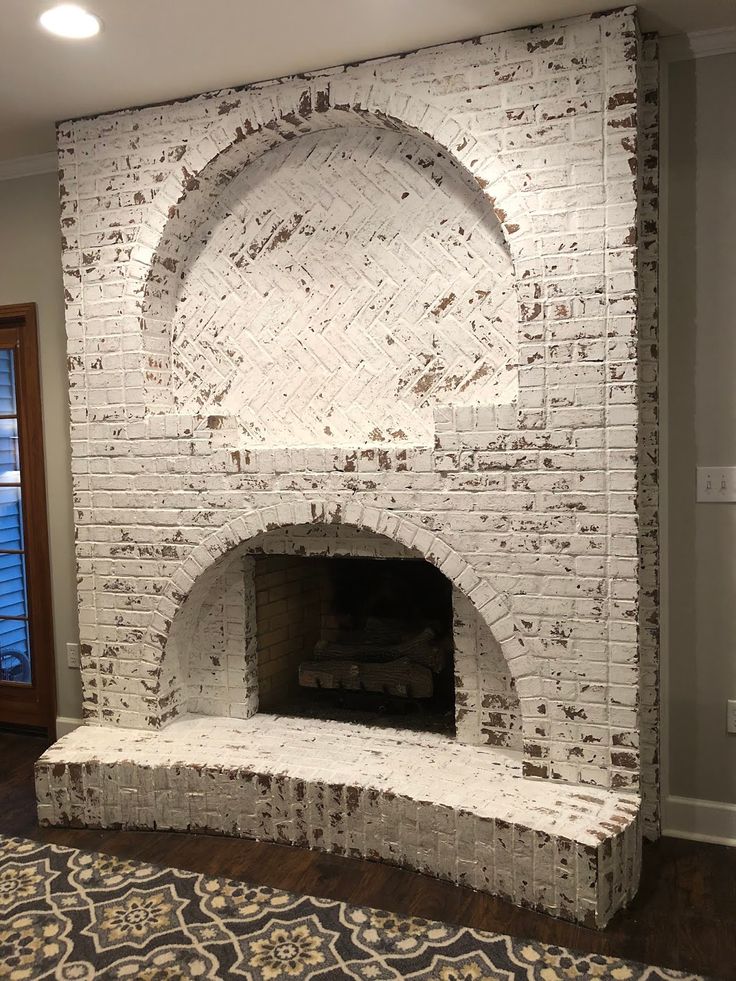 a white brick fireplace in a living room