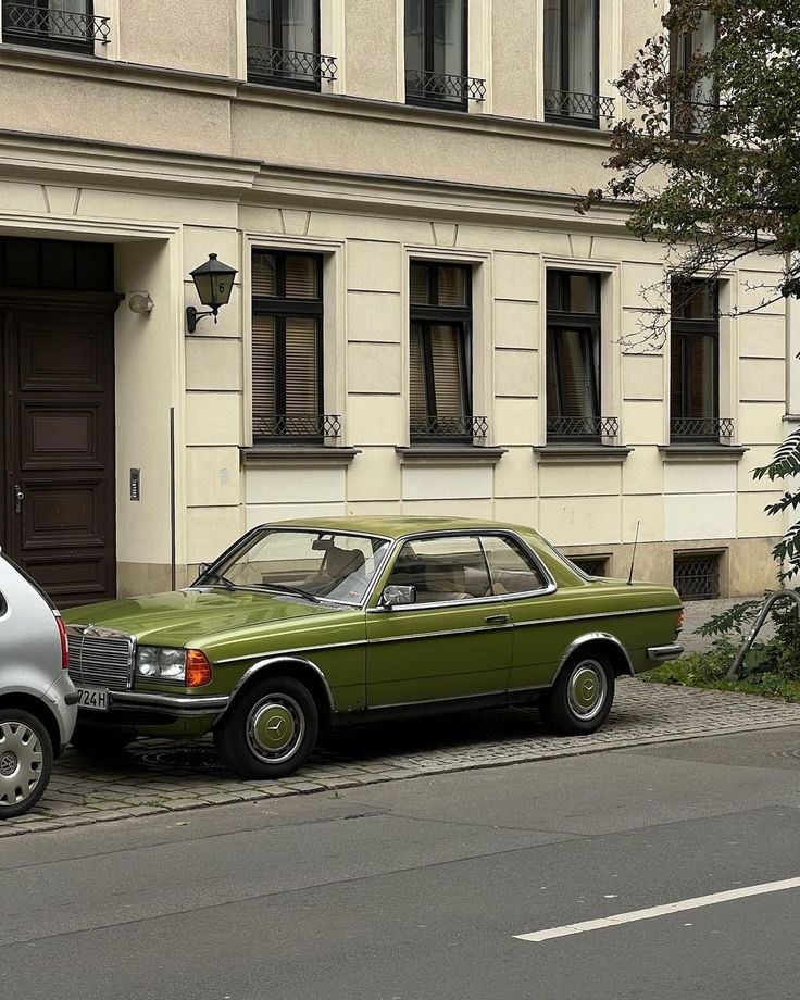 two cars are parked on the side of the street