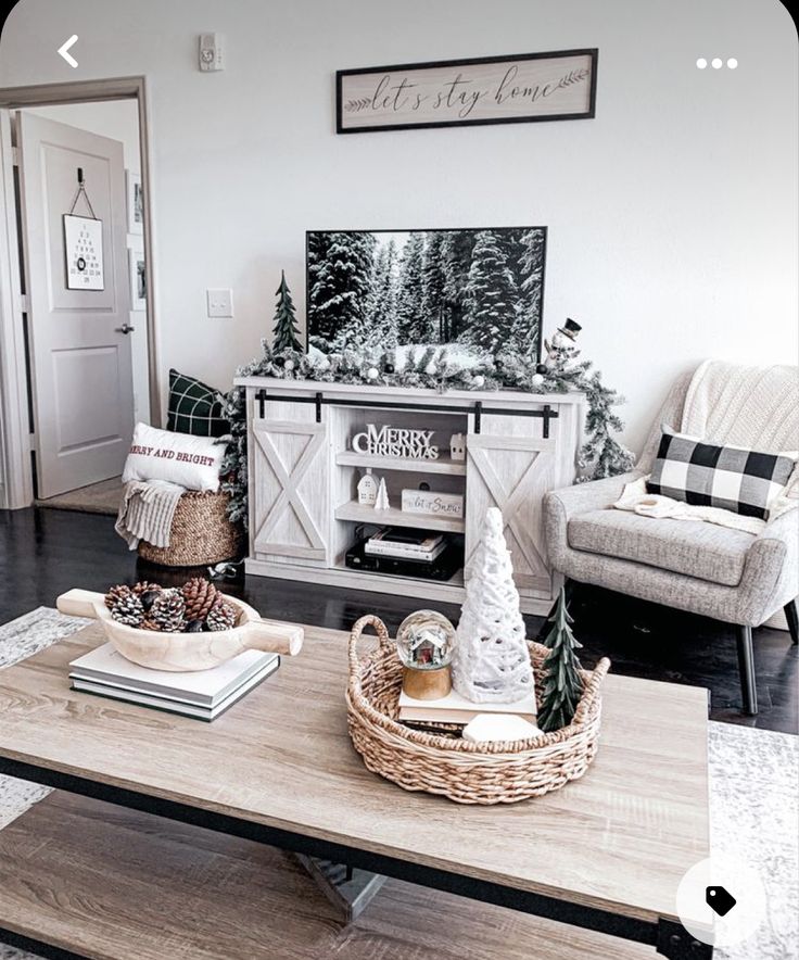 a living room filled with furniture and a christmas tree on top of a coffee table