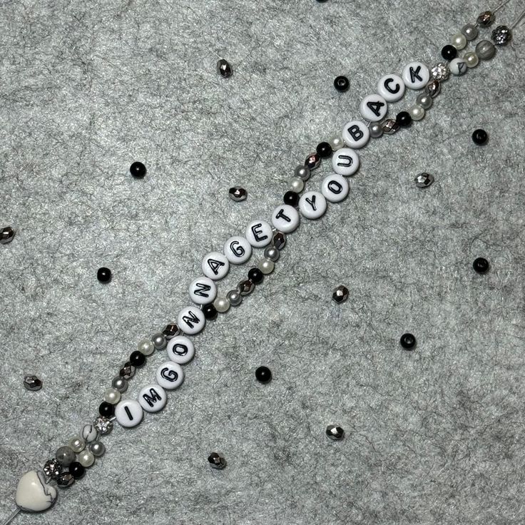 a beaded necklace with the word love spelled on it