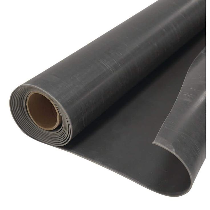 a roll of black rubber sheeting sitting on top of a white surface