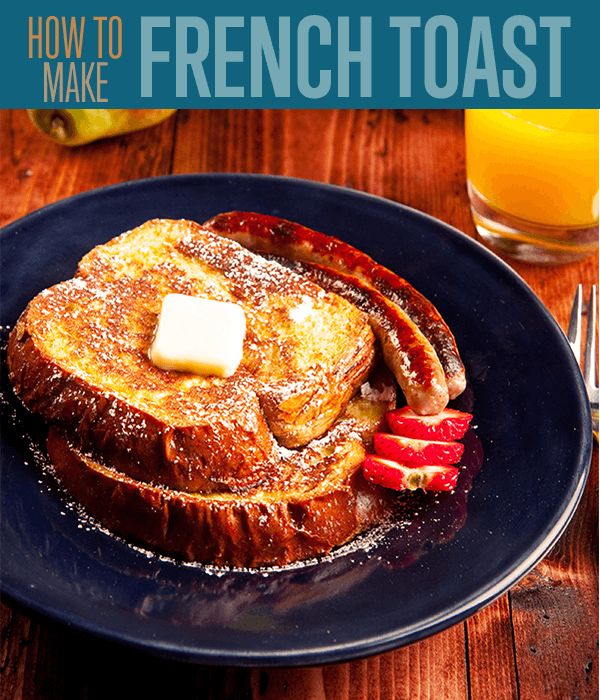 french toast with butter and strawberries on a blue plate next to a glass of orange juice