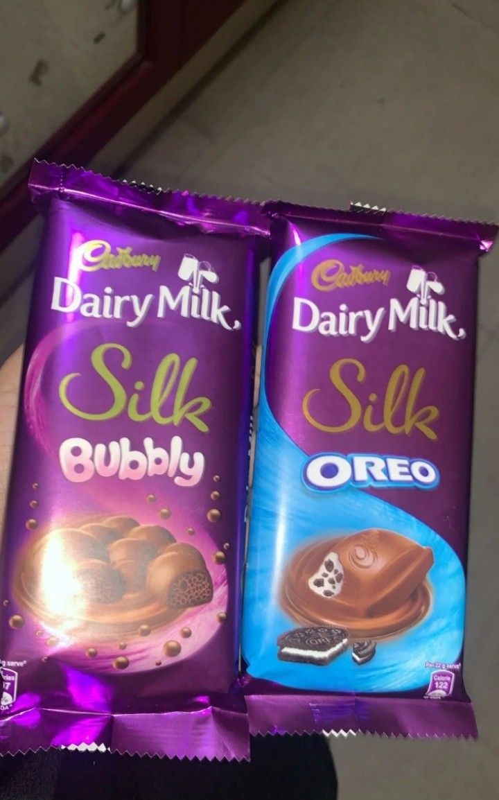 two bars of dairy milk and silk chocolate