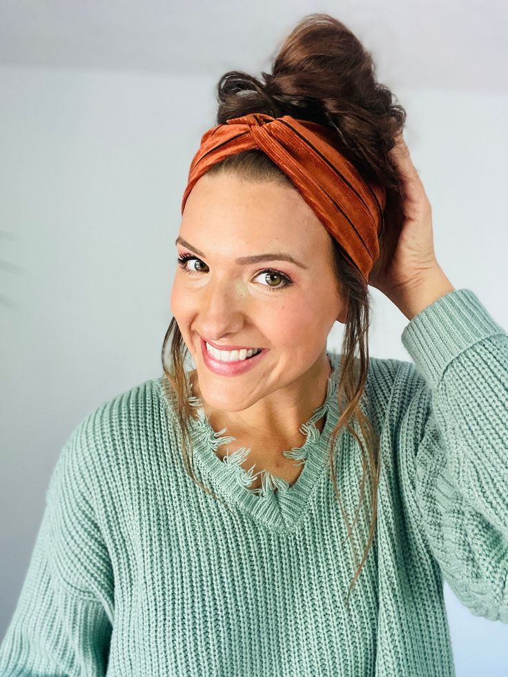 "This corduroy headband is stretchy and soft yet so warm-PERFECT for the upcoming fall and winter seasons. It comes in a rustic orange/copper with thin black stripes. Can choose to add buttons to it to hold your mask for no extra charge. Versatile and cute, sure to suit your needs! Due to the nature of corduroy it is a more snug fit then our other headbands but still has give.  one-size-fits-most Width: 3\"-3.5\" depending on if you choose to bunch up the seam or not. CARE INSTRUCTIONS: Although we wash fabric in Mollys Suds before cutting into or ironing it, we still recommend you machine or hand wash on cold and air or tumble dry for increased longevity." Big Headbands, Fall Headband, Warm Headbands, Fall Headbands, Rustic Orange, Twisted Headband, Headband Boho, Orange Copper, Headband Outfit