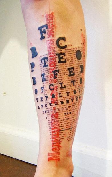 a person's leg with a crossword tattoo on it and the words written in different languages