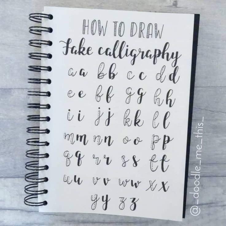 a spiral notebook with the words how to draw in cursive writing on it